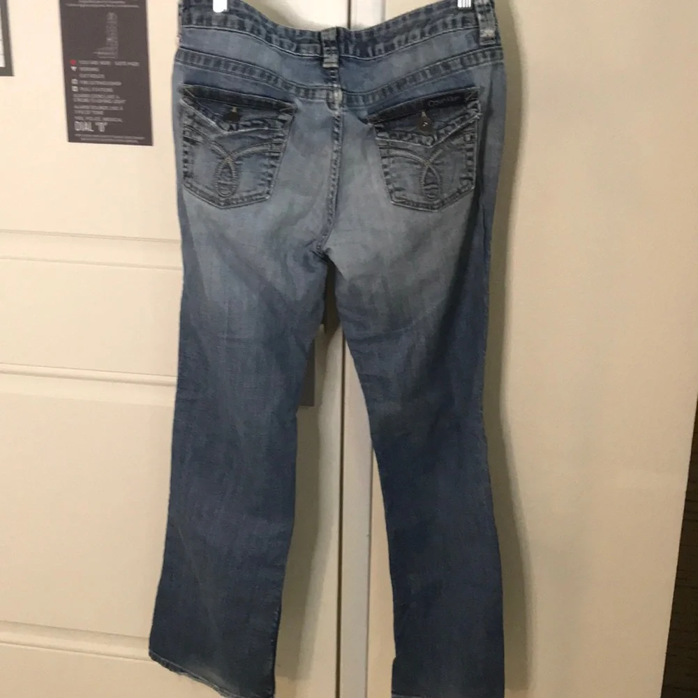 Calvin Klein distressed medium dark wash jeans 10